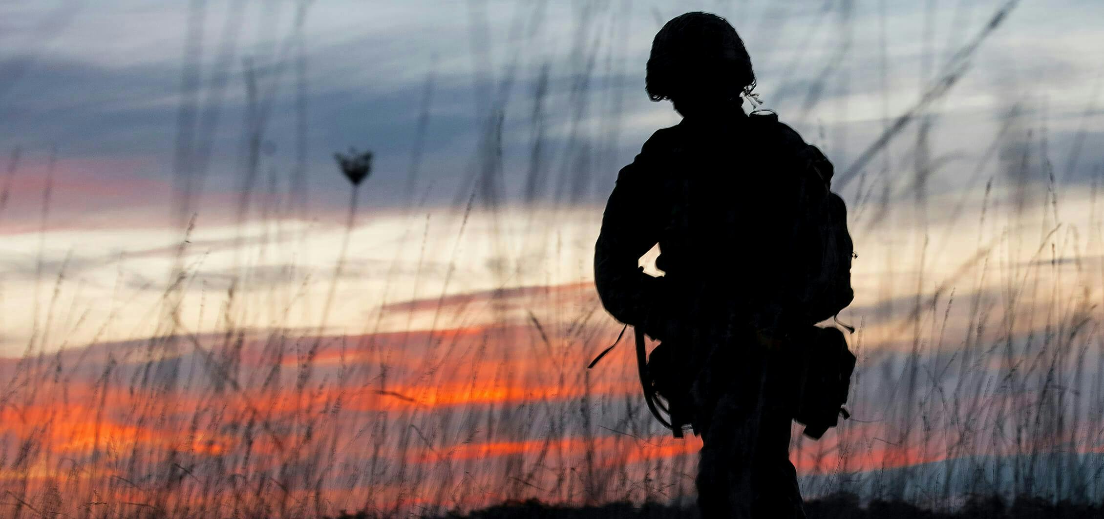 Silhouette of a solider at sunrise 