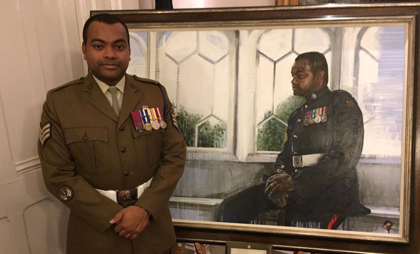 Johnson Beharry with a portrait of himself 